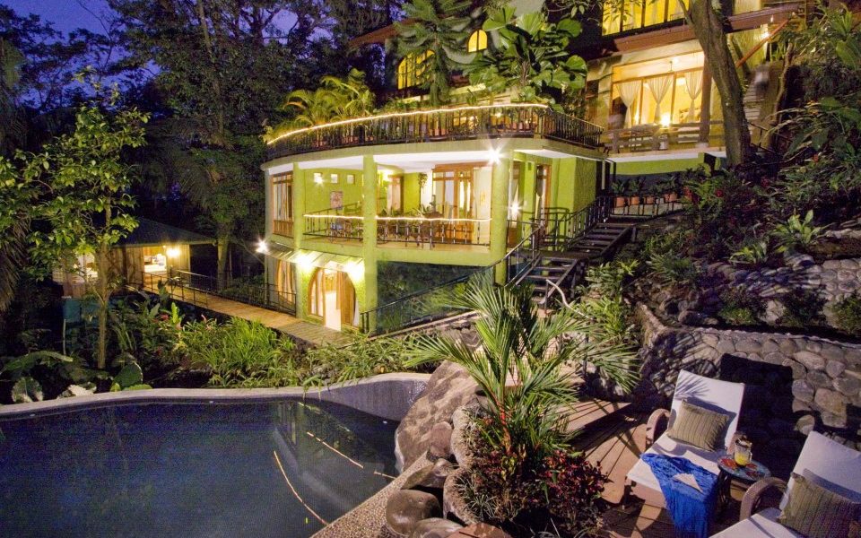 This villa in Manuel Antonio is set in the lush jungle with a huge pool and deck and lights up at night beautifully. 