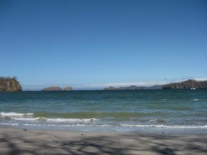 Playa Del Coco shore line with tranquil waters in Costa Rica