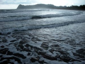 Beautiful rolling beach wave along Nosara Costa Rica