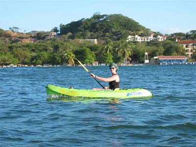 Tamarindo kayaking along the beach while on vacation with family