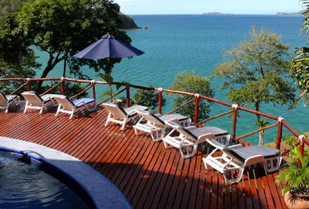 Private pool surrounded by sun deck and lounge chairs for a relaxing Costa Rican holiday