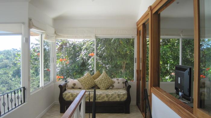 The master bedroom balcony with gorgeous jungle views is the perfect spot to enjoy a fresh morning coffee.