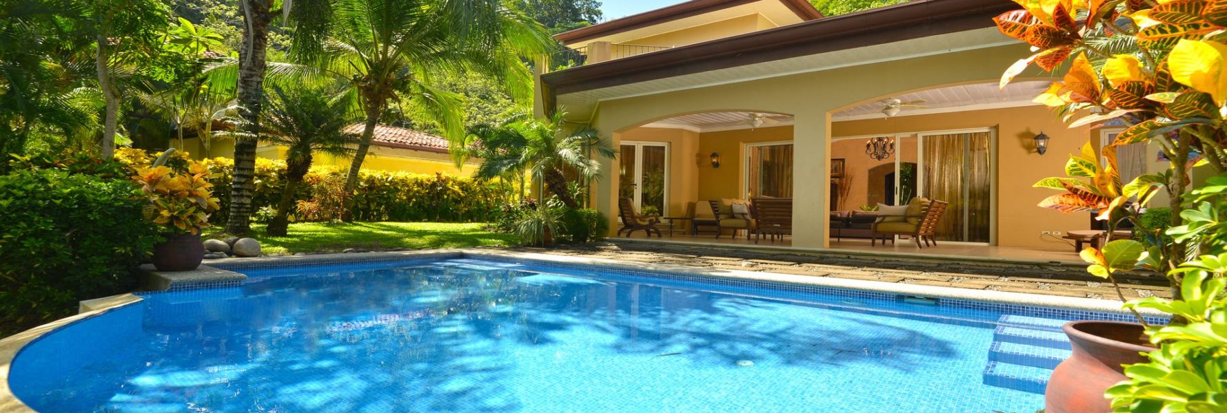 Outdoor pool surrounded by green tropical gardens. JA-04 is the perfect tropical destination for your next vacation.
