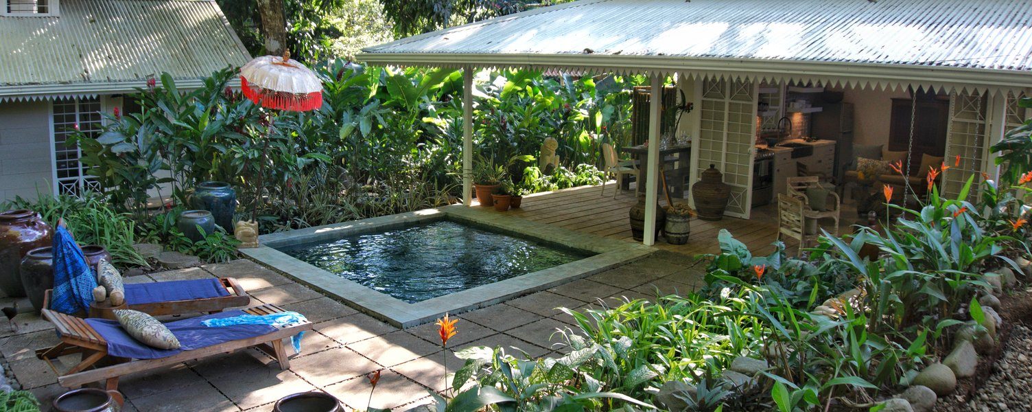 Gardens surround the property which includes a main house and separate casita with the plunge pool in-between.