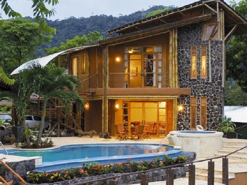 Private casita features stone walls, bamboo terraces and an infinity pool
