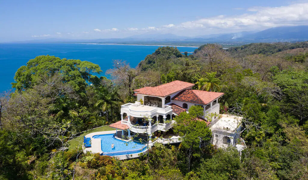 This four-bedroom mansion in the jungle sits high up above the canopy and enjoys breathtaking ocean views.