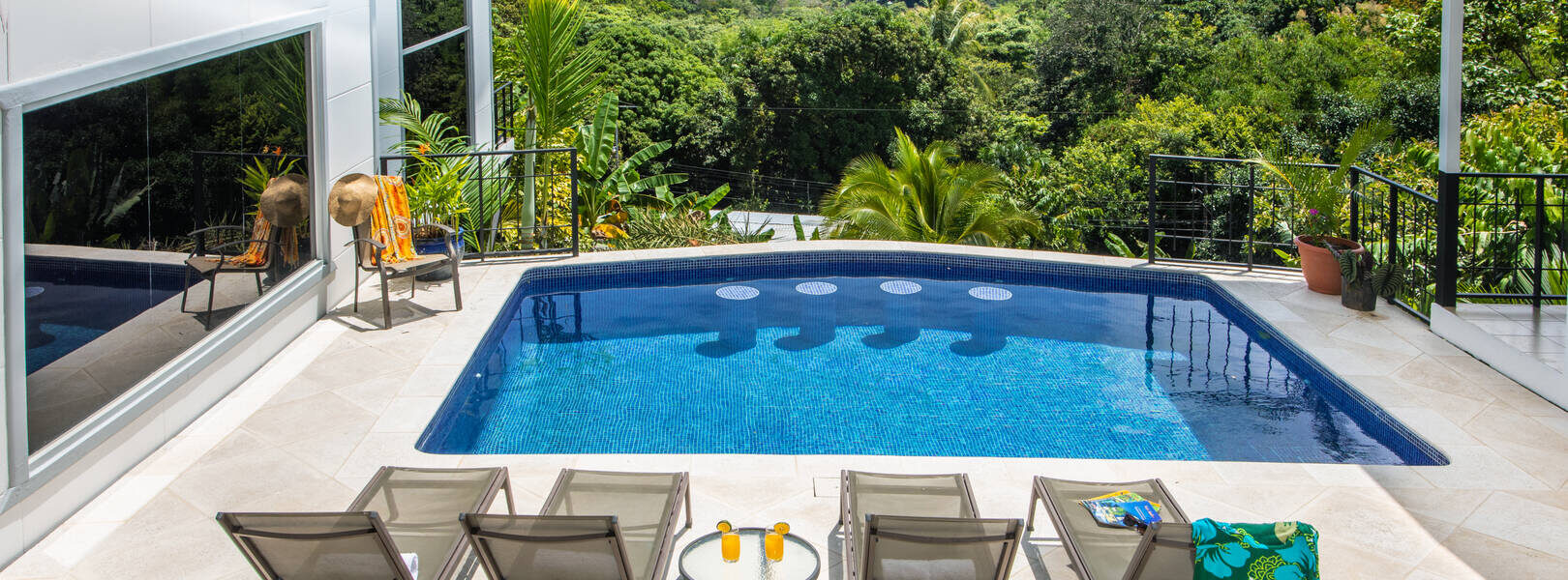 The private pool sits just steps from the main house and has a breathtaking Manuel Antonio ocean view.