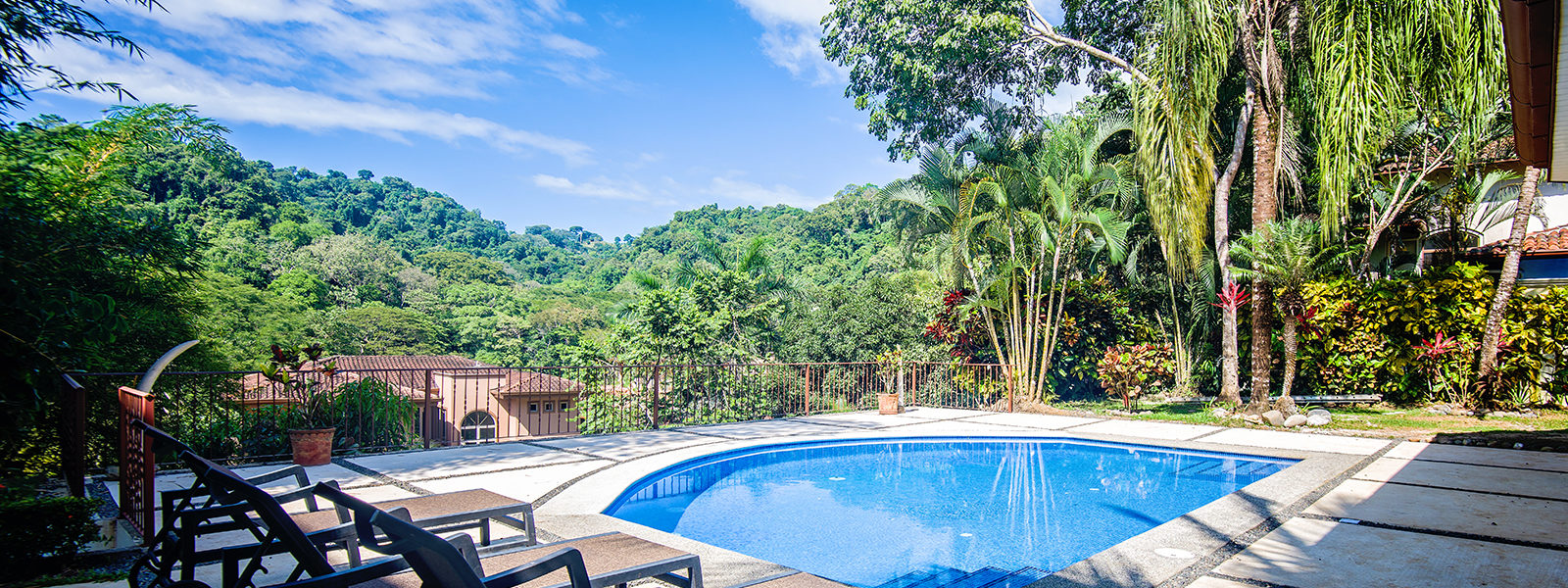 This luxury villa features a large secluded pool surrounded by lush, tropical beauty.