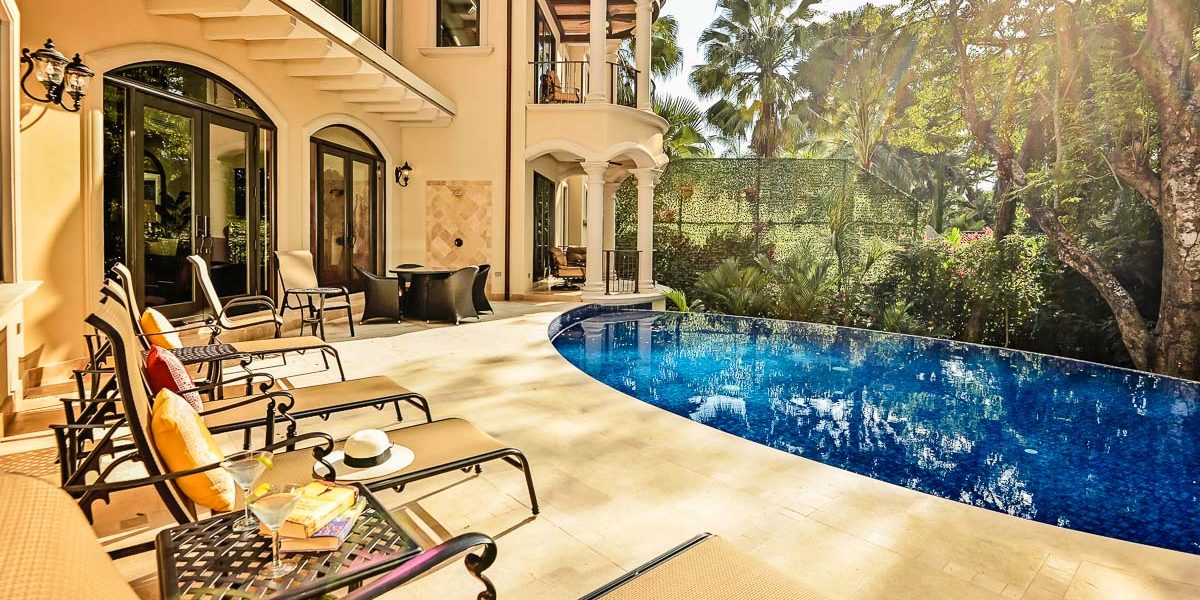 A glimpse of pure luxury: our sun-kissed private pool oasis, complete with a lounging haven for sunbathing and exotic refreshments.