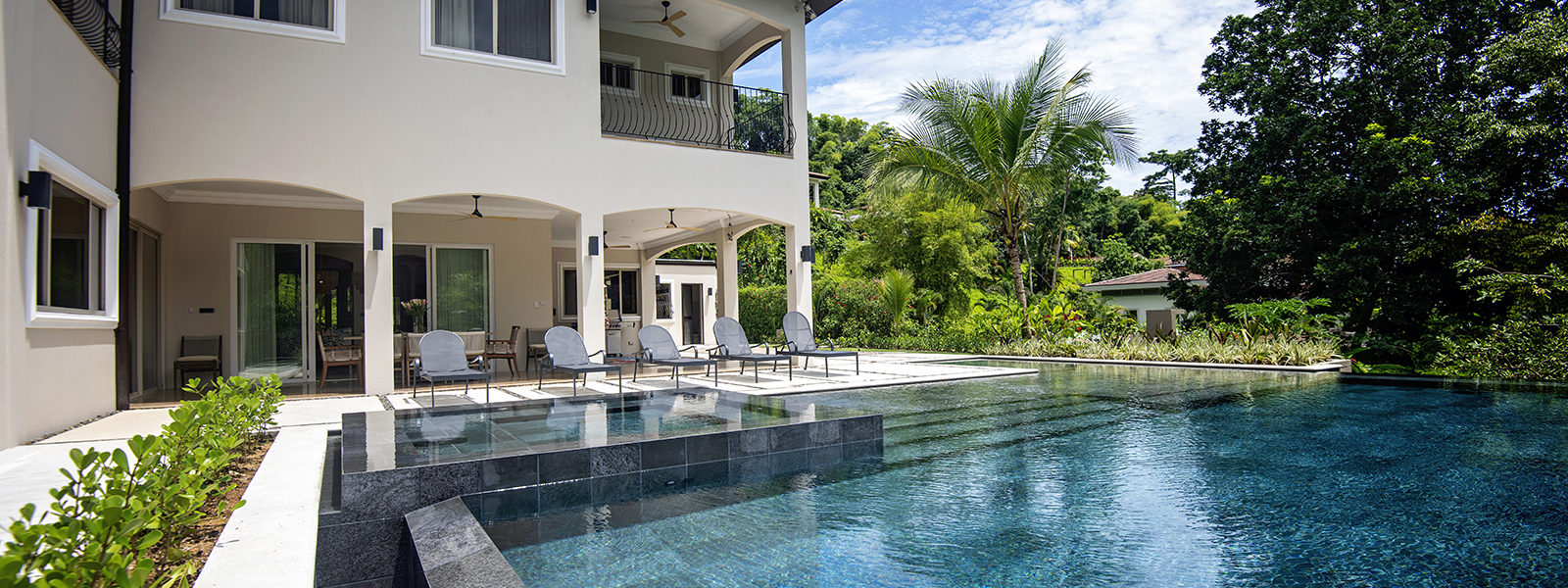 Our modern pool and lounge area seamlessly blend with the surrounding rainforest