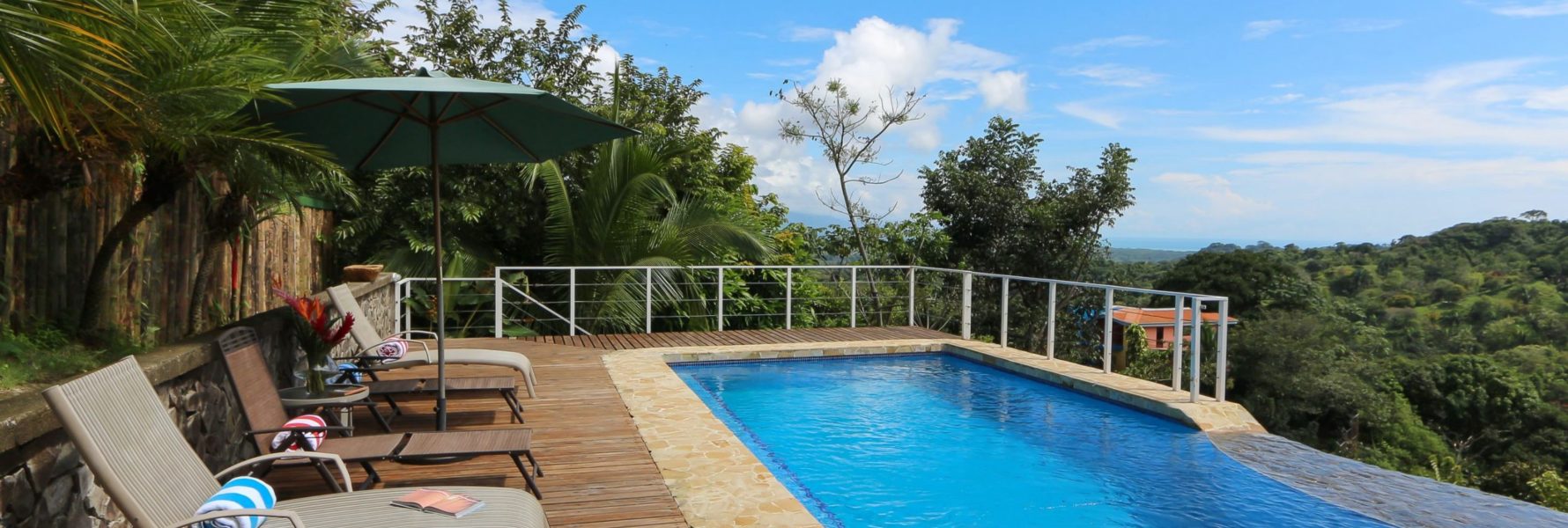 The gorgeous pool and deck area floats out over the treetops of the rainforest below.