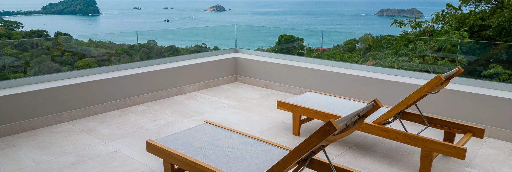 The rooftop terrace offers ample space to lounge while admiring the ocean vista.