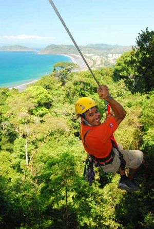 jaco-canopy-tours-climb-into the canopy-ocean and green trees below